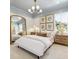 Bedroom with modern light fixture and mirror with white walls and blue trim at 353 Claret Cup Way, Charleston, SC 29414