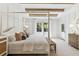 Bright bedroom with neutral walls, a four poster bed, and wooden beam ceiling accents at 353 Claret Cup Way, Charleston, SC 29414