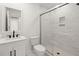 Contemporary bathroom with a marble shower and a white vanity with black fixtures at 358 Highway 78, Ridgeville, SC 29472