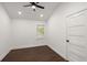 A bedroom with dark hardwood floors, a modern ceiling fan, recessed lighting, and a window at 358 Highway 78, Ridgeville, SC 29472