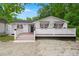 Charming home with white siding, black trim, and cozy front porch at 358 Highway 78, Ridgeville, SC 29472