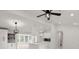Bright kitchen featuring white cabinets, a modern island, and stylish lighting fixtures at 358 Highway 78, Ridgeville, SC 29472