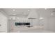 Bright kitchen featuring white cabinets, a modern island, and an extractor fan at 358 Highway 78, Ridgeville, SC 29472