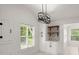 Bright kitchen featuring white cabinets, a modern window, and stylish lighting at 358 Highway 78, Ridgeville, SC 29472