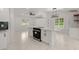 Kitchen island with black range set in white quartz top with white cabinets and black fittings at 358 Highway 78, Ridgeville, SC 29472