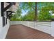 Spacious wood porch with white railing, perfect for outdoor enjoyment at 358 Highway 78, Ridgeville, SC 29472