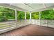 Relaxing outdoor porch area featuring a wooden floor and a scenic nature view at 358 Highway 78, Ridgeville, SC 29472