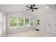 Bright sunroom featuring marble floors, recessed lighting, ceiling fan, and multiple windows providing ample natural light at 358 Highway 78, Ridgeville, SC 29472