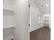A white walk-in closet with shelving and plenty of space for storage at 358 Highway 78, Ridgeville, SC 29472