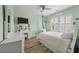 Stylized bedroom with pastel green walls, a large window, and a comfortable-looking bed at 3656 Spindrift Dr, Mount Pleasant, SC 29466