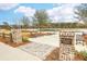 Picturesque park entrance with brick details, benches, and lake views at 3656 Spindrift Dr, Mount Pleasant, SC 29466