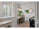Dining area features shiplap walls, plantation shutters, decorative mirrors, and elegant furnishings at 3656 Spindrift Dr, Mount Pleasant, SC 29466