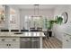 Dining room with shiplap walls, plantation shutters, and a modern chandelier at 3656 Spindrift Dr, Mount Pleasant, SC 29466