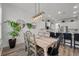 Open-concept dining area features shiplap walls, modern lighting, and a view into the kitchen at 3656 Spindrift Dr, Mount Pleasant, SC 29466