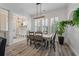 Charming dining room with shiplap walls, bright windows, and views into entryway at 3656 Spindrift Dr, Mount Pleasant, SC 29466