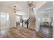 Foyer with hardwood floors, stairs, and a view of the bonus room and bedroom at 3656 Spindrift Dr, Mount Pleasant, SC 29466