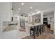 Open kitchen boasts stainless steel appliances and island seating at 3656 Spindrift Dr, Mount Pleasant, SC 29466