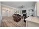 Bright living room features hardwood floors, ship lap accent wall and a cozy fireplace at 3656 Spindrift Dr, Mount Pleasant, SC 29466