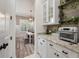 Butler's pantry features granite counters, cabinet space, and view to the nearby dining room at 3656 Spindrift Dr, Mount Pleasant, SC 29466
