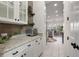 Butler's pantry with granite countertops, ample cabinet space, and decorative accents at 3656 Spindrift Dr, Mount Pleasant, SC 29466