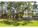Scenic community picnic area shaded by mature trees with lake views at 3656 Spindrift Dr, Mount Pleasant, SC 29466