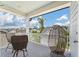Covered porch with wicker furniture seating, and neighborhood views at 3656 Spindrift Dr, Mount Pleasant, SC 29466