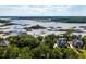 Breathtaking aerial showcases waterfront property with dock near tranquil waterways, perfect for relaxed, waterside living at 3948 Gift Blvd, Johns Island, SC 29455