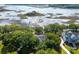 Waterfront houses seen from above show private docks leading to tranquil waterways surrounded by lush landscapes at 3948 Gift Blvd, Johns Island, SC 29455