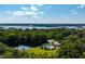 Scenic aerial shot of a community pool, tennis courts, and stunning waterway views at 3948 Gift Blvd, Johns Island, SC 29455