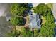 Stunning aerial view of home with gray roof, dock, and well-manicured lawn at 3948 Gift Blvd, Johns Island, SC 29455