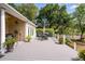 Spacious back porch, ideal for entertaining, with a dining set, grilling area, and well-manicured yard at 3948 Gift Blvd, Johns Island, SC 29455