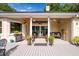 Covered patio with decorative columns and ceiling fans offering comfortable outdoor living at 3948 Gift Blvd, Johns Island, SC 29455