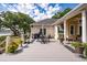 Overlooking the property and waterfront, this outdoor deck features a patio table, grill, and lush landscaping at 3948 Gift Blvd, Johns Island, SC 29455