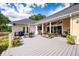 Large outdoor deck with patio furniture, ceiling fans and beautiful views of the backyard at 3948 Gift Blvd, Johns Island, SC 29455