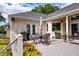 Open air back deck featuring outdoor seating, grill, manicured landscaping, and natural light at 3948 Gift Blvd, Johns Island, SC 29455