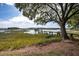 Lush backyard featuring a wooden dock with a kayak launch for easy water access at 3948 Gift Blvd, Johns Island, SC 29455