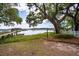Scenic backyard offering tranquil water views, a private dock, and verdant landscaping at 3948 Gift Blvd, Johns Island, SC 29455