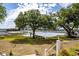 View of the marsh and tidal creek from the backyard, featuring a large live oak at 3948 Gift Blvd, Johns Island, SC 29455