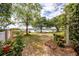 Spacious backyard with well-manicured lawn, gardens, and serene water views at 3948 Gift Blvd, Johns Island, SC 29455