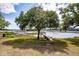 Backyard featuring water views, mature trees, and private dock at 3948 Gift Blvd, Johns Island, SC 29455