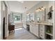 Bright bathroom with double vanity, marble countertops, soaking tub, and waterfront views at 3948 Gift Blvd, Johns Island, SC 29455