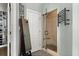 Bathroom featuring a glass-enclosed shower with a heated towel rack and view of a shoe storage area at 3948 Gift Blvd, Johns Island, SC 29455