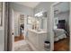 Stylish bathroom with a white vanity, decorative rug, and access to an adjacent bedroom at 3948 Gift Blvd, Johns Island, SC 29455