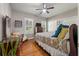 Cozy bedroom with hardwood floors, ceiling fan, and traditional furnishings that create a warm and inviting atmosphere at 3948 Gift Blvd, Johns Island, SC 29455