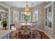 Cozy dining area with chandelier, views, and a decorative cabinet at 3948 Gift Blvd, Johns Island, SC 29455