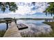 Waterfront view showcasing a private dock with a bench and floating platform, with reflections on the water at 3948 Gift Blvd, Johns Island, SC 29455