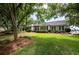 Beautiful home with a well-manicured lawn and manicured landscaping at 3948 Gift Blvd, Johns Island, SC 29455