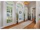 Elegant foyer featuring hardwood floors, a chandelier, and tall windows that provide ample natural light at 3948 Gift Blvd, Johns Island, SC 29455