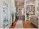 Inviting foyer with hardwood floors, elegant lighting, and decorative accents that lead into a cozy living space at 3948 Gift Blvd, Johns Island, SC 29455