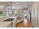 Open-concept kitchen featuring countertops, stainless steel appliances, and a view of the dining area at 3948 Gift Blvd, Johns Island, SC 29455